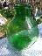 Damigiana antica in vetro di colore verde,